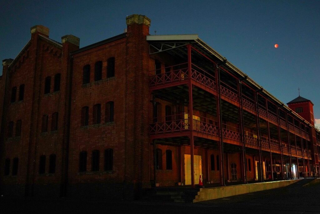 Eclipse over Red Brick Warehouse